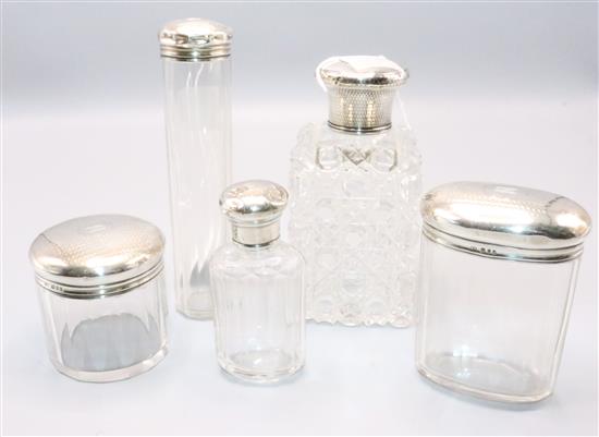 Victorian cut glass silver-mounted scent bottle & a set of four later silver-mounted toilet jars